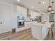 Modern kitchen with white cabinets, stainless steel appliances, and kitchen island at 28065 N 171St Dr, Surprise, AZ 85387