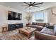 Cozy living room with stylish decor, large window, and comfortable seating arrangement at 28065 N 171St Dr, Surprise, AZ 85387