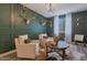 Living room with decorative wall, chandelier, and seating at 28065 N 171St Dr, Surprise, AZ 85387