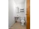 Simple bathroom featuring a standard toilet, sink, mirror and minimal storage at 2834 E Michael Dr, Phoenix, AZ 85032