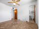 Bright bedroom featuring a doorway leading to a bathroom with a toilet and sink at 2834 E Michael Dr, Phoenix, AZ 85032