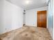 This is a bedroom with neutral carpet, white walls, and wood closet doors at 2834 E Michael Dr, Phoenix, AZ 85032