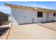 This is a side-view of the garage, showing the concrete driveway and brick-lined edge at 2834 E Michael Dr, Phoenix, AZ 85032