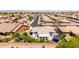 Neighborhood aerial view showcasing neat landscaping, tiled roofs, private backyard, and an orderly layout at 2910 S Olivewood --, Mesa, AZ 85212