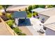 Overhead view of the backyard with covered patios, landscaped lawn, and picnic table seating area at 2910 S Olivewood --, Mesa, AZ 85212