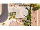 Overhead view showcasing the roof, landscaping, and outdoor living space of this meticulously maintained single-story home at 2910 S Olivewood --, Mesa, AZ 85212