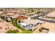 Aerial view of a neighborhood featuring well-maintained homes, landscaping, and private backyard patios at 2910 S Olivewood --, Mesa, AZ 85212