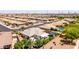 Aerial view of a peaceful neighborhood with homes featuring tidy yards, back patios, and organized streets at 2910 S Olivewood --, Mesa, AZ 85212