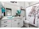 Bright bathroom featuring a vanity with quartz countertop and decorative shower curtain at 2910 S Olivewood --, Mesa, AZ 85212