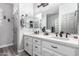 Bathroom featuring double sinks, white cabinets, and modern fixtures at 2910 S Olivewood --, Mesa, AZ 85212