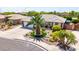 Well-manicured home featuring lush landscaping and a large driveway, creating a welcoming curb appeal at 2910 S Olivewood --, Mesa, AZ 85212