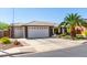 Charming single-story home with a three-car garage and desert landscaping at 2910 S Olivewood --, Mesa, AZ 85212