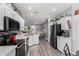 Spacious kitchen with stainless steel appliances, white cabinets, and ample counter space at 2910 S Olivewood --, Mesa, AZ 85212