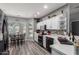 Modern kitchen with black appliances, quartz countertops, and a cozy dining area at 2910 S Olivewood --, Mesa, AZ 85212