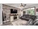 Comfortable living room with a decorative fireplace and a large leather couch at 2910 S Olivewood --, Mesa, AZ 85212