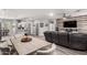 Open-concept living space with dining area, comfortable seating, and modern flooring at 2910 S Olivewood --, Mesa, AZ 85212