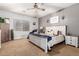 Comfortable bedroom with a ceiling fan, a bed, and carpet at 2910 S Olivewood --, Mesa, AZ 85212