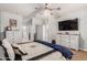 Bright bedroom with stylish furnishings, ceiling fan, and carpet at 2910 S Olivewood --, Mesa, AZ 85212
