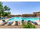 Inviting community pool surrounded by seating and lush greenery, perfect for relaxation and recreation at 2910 S Olivewood --, Mesa, AZ 85212