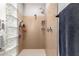 Modern shower with dual shower heads and decorative glass block wall at 2910 S Olivewood --, Mesa, AZ 85212