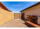 This side yard features a gravel bed, fencing, and a gate at 2910 S Olivewood --, Mesa, AZ 85212