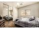 Comfortable bedroom featuring a ceiling fan and sliding mirror closet at 3032 W Red Fox Rd, Phoenix, AZ 85083