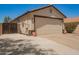 Spacious two-car garage, accessed by a long driveway, provides ample parking and storage space at 3032 W Red Fox Rd, Phoenix, AZ 85083