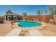 Inviting backyard oasis with a pool, hot tub, gazebo and lounge chairs at 3032 W Red Fox Rd, Phoenix, AZ 85083