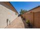 The property has a side yard that leads to the backyard at 3032 W Red Fox Rd, Phoenix, AZ 85083