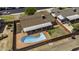 Aerial view of a property with a private pool, covered patio, and fenced backyard at 308 E La Jolla Dr, Tempe, AZ 85282