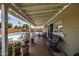 Covered back porch featuring plants, furniture, and view of the backyard pool at 308 E La Jolla Dr, Tempe, AZ 85282