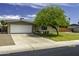Charming single-story home with a well-maintained lawn and mature landscaping at 308 E La Jolla Dr, Tempe, AZ 85282