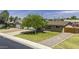 Charming home featuring a green lawn, mature shade tree, and convenient driveway at 308 E La Jolla Dr, Tempe, AZ 85282