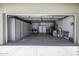Spacious garage featuring storage cabinets and space for parking and laundry appliances at 308 E La Jolla Dr, Tempe, AZ 85282