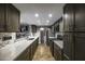 Modern kitchen features a long quartz countertop, stainless appliances and stylish cabinets at 308 E La Jolla Dr, Tempe, AZ 85282