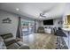 Spacious living room with tile floor, access to the backyard, and a comfortable seating area at 308 E La Jolla Dr, Tempe, AZ 85282