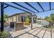 Backyard with built-in barbecue, covered patio, sparkling pool, lounge chairs, and desert landscaping at 3280 E Coconino Dr, Gilbert, AZ 85298