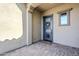 Welcoming front entry with a modern door, sidelight window, and paver flooring at 3280 E Coconino Dr, Gilbert, AZ 85298