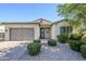 Charming single-story home with manicured landscaping and a welcoming blue front door at 3280 E Coconino Dr, Gilbert, AZ 85298