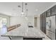 This kitchen features stainless steel appliances, granite countertops and dark cabinets at 3280 E Coconino Dr, Gilbert, AZ 85298