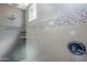 Tiled shower features mosaic accents, rainfall shower head, handheld shower, and corner shelves at 3280 E Coconino Dr, Gilbert, AZ 85298