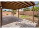 A backyard featuring a covered patio and block wall at 3353 E Blackhawk Dr, Phoenix, AZ 85050