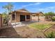 Backyard featuring a covered patio, block wall and drought tolerant landscaping at 3353 E Blackhawk Dr, Phoenix, AZ 85050