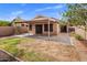 Backyard featuring a covered patio, block wall and drought tolerant landscaping at 3353 E Blackhawk Dr, Phoenix, AZ 85050