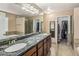 Bathroom featuring a dual sink vanity, large mirror, and shower at 3353 E Blackhawk Dr, Phoenix, AZ 85050