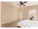 Comfortable bedroom featuring neutral walls, a ceiling fan, and an ensuite bathroom at 3353 E Blackhawk Dr, Phoenix, AZ 85050