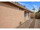 Home exterior featuring neutral color palette, desert landscaping, and private walkway at 3353 E Blackhawk Dr, Phoenix, AZ 85050