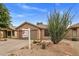 A home exterior showcasing desert landscaping and a neutral color palette at 3353 E Blackhawk Dr, Phoenix, AZ 85050