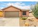 Charming single-story home featuring a xeriscaped front yard and a two-car garage at 3353 E Blackhawk Dr, Phoenix, AZ 85050