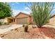 Single-story home with desert landscaping and a spacious driveway at 3353 E Blackhawk Dr, Phoenix, AZ 85050